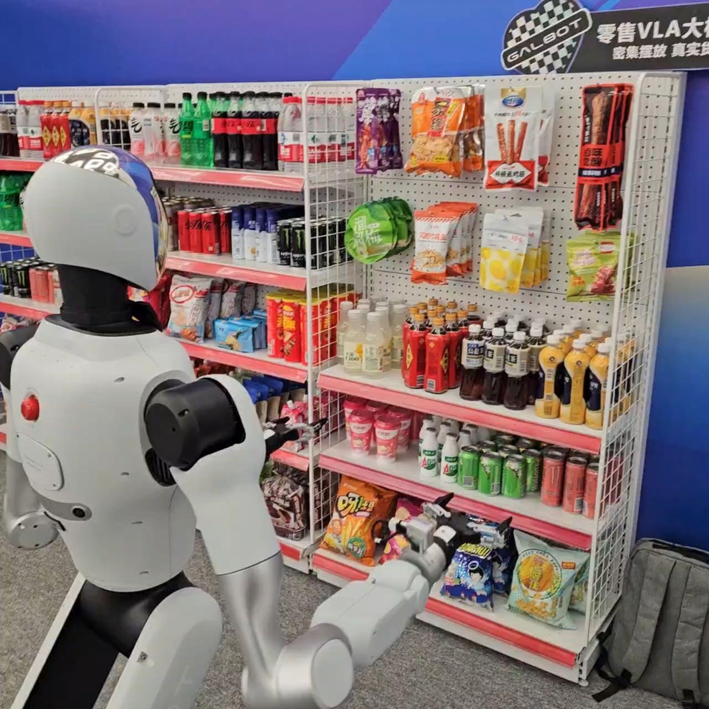 Wheeled humanoid robot picking products from retail shelving